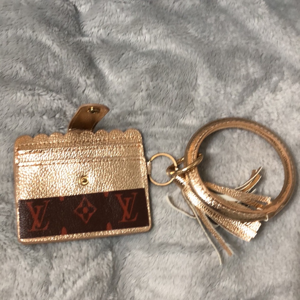 NWOT. Wristlet. Gold. Not Luxury - Picture 3 of 3